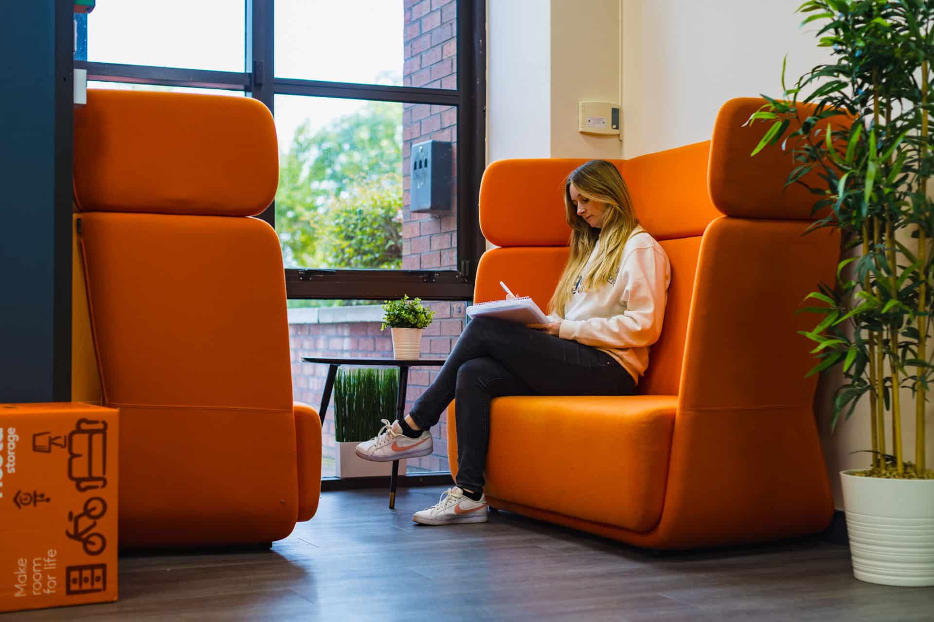 Premier Business Centres, woman sitting in break out area
